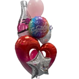Cluster of colorful congratulatory balloons with heart and star shapes