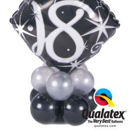 Black number 18 balloon with silver balloons at the base