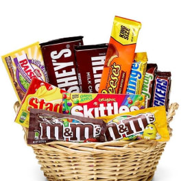 Basket filled with assorted candy bars and chocolate treats
