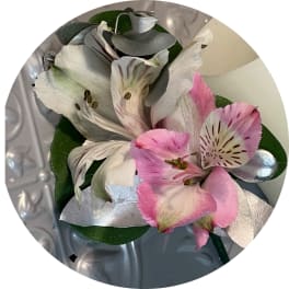 Pink and white alstroemeria flowers with silver leaves
