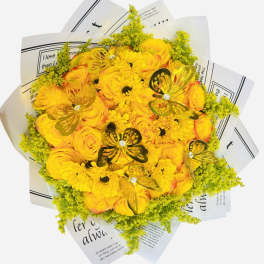 Yellow rose and daisy bouquet with butterfly decorations