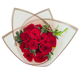 Bouquet of red roses wrapped in translucent paper