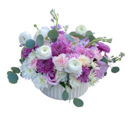 Pink and white mixed flower arrangement in a white vase