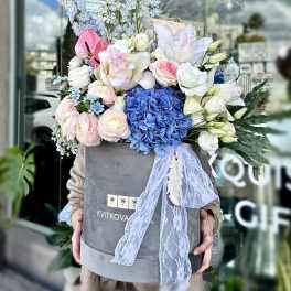 Large pastel bouquet in a gray box with lace ribbon