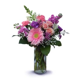 Pink and purple mixed bouquet in a clear glass vase