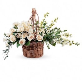 Cream roses arranged in a wicker basket