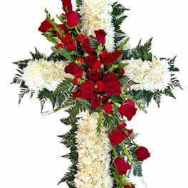 Cross-shaped floral spray with red roses and white chrysanthemums