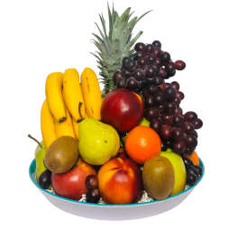 Fruit arrangement in a shallow bowl with bananas, grapes, pineapple, and assorted fruit