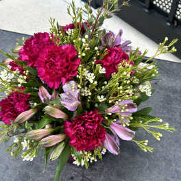 Bouquet of hot pink carnations and lavender alstroemeria