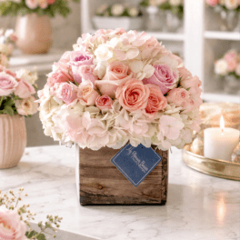 Pink and white rose bouquet in a rustic wooden box