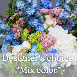 Mixed bouquet of blue, white, pink, and green flowers