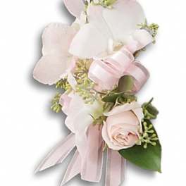 Pink and white floral corsage with ribbon and a rose