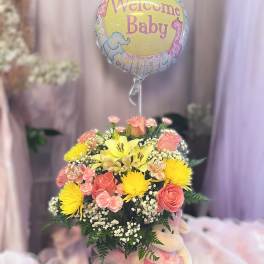 Bouquet with a welcome baby balloon and a plush toy