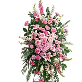 Tall pink floral standing spray on an easel