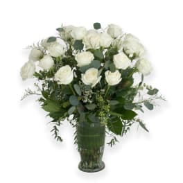 White rose bouquet in a clear glass vase