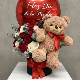 Red balloon with roses and teddy bear in a gift box