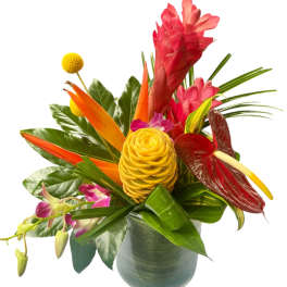 Tropical bouquet in a gray vase with red, orange, and yellow blooms