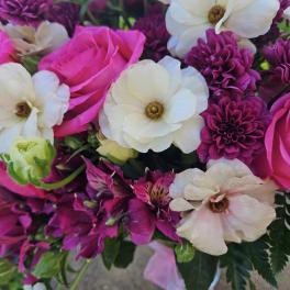 Bouquet of pink and white flowers with purple blooms
