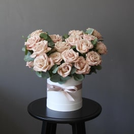 Blush rose bouquet in a white hat box with ribbon