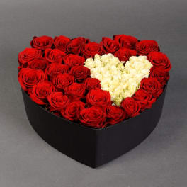 Heart-shaped box of red and white roses