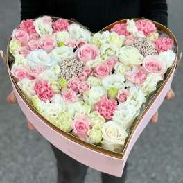 Heart-shaped box of pink and white roses and carnations