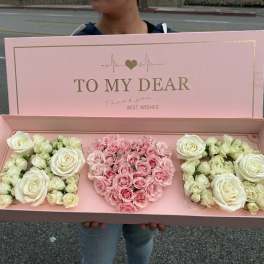 Pink gift box with roses and a heart-shaped floral arrangement