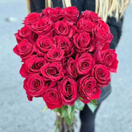 Bouquet of red roses held upright