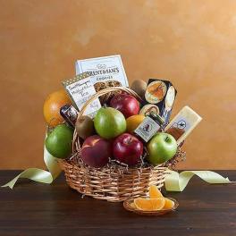 Fruit basket with apples, pears, oranges, and packaged snacks