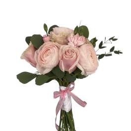 Blush pink rose bouquet tied with a pink ribbon
