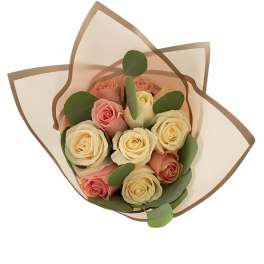 Bouquet of pink and cream roses wrapped in translucent paper