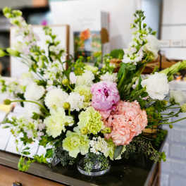Mixed pastel flower arrangement in a clear glass vase