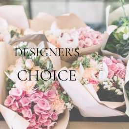 Assorted pastel flower bouquets wrapped in paper with "Designer’s Choice" text