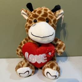 Plush giraffe holding a red heart with the word LOVE