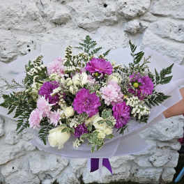 Hand-tied bouquet of pink and purple flowers with white roses