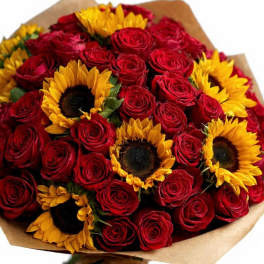 Bouquet of red roses and yellow sunflowers wrapped in brown paper