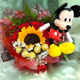 Bouquet of red roses, a sunflower, chocolates, and a Mickey Mouse plush