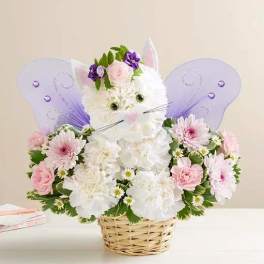 Flower basket arranged as a white cat with purple butterfly wings