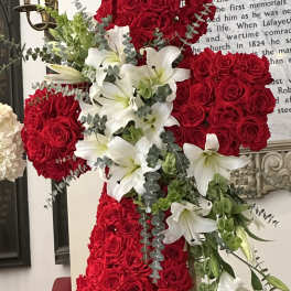 Red rose cross with white lilies and greenery