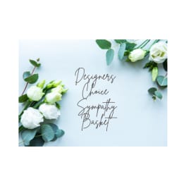 White roses with eucalyptus around sympathy basket text