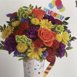 Colorful bouquet in a party cup with balloons and a "CELEBRA EL" topper