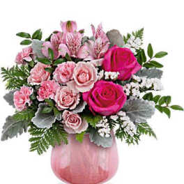 Pink roses and carnations in a pink glass vase