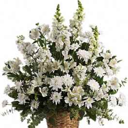 White floral arrangement in a woven basket