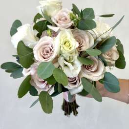 Bouquet of pale pink and white roses with eucalyptus