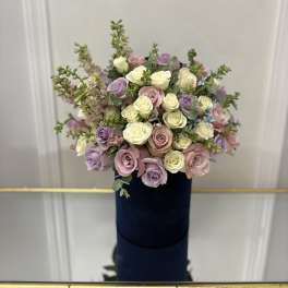 Bouquet of pastel roses in cream, pink, and lavender