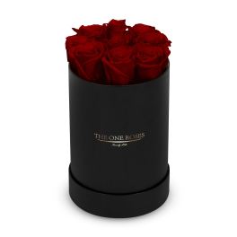 Red roses arranged in a black cylindrical box