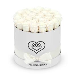 Round box of white roses with a ribbon bow