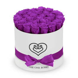 Round box of purple roses with a satin ribbon