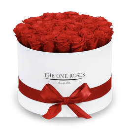 Round box of red roses with a red ribbon