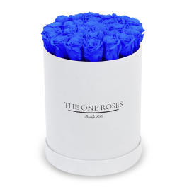 Blue roses arranged in a white round box