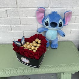 Heart-shaped box of red roses with chocolates and a plush Stitch toy